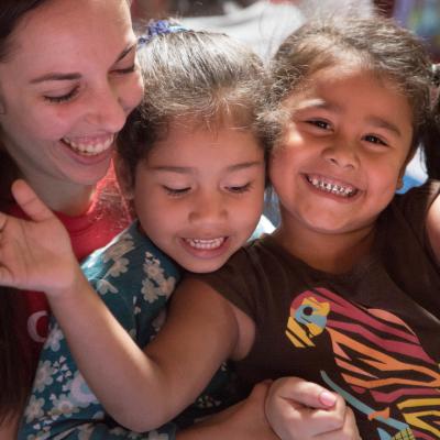 A volunteer on an alternative spring break in Costa Rica plays a game with a child. A volunteer on an alternative spring break in Costa Rica plays a game with a child.